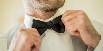 Man Holding His Bowtie